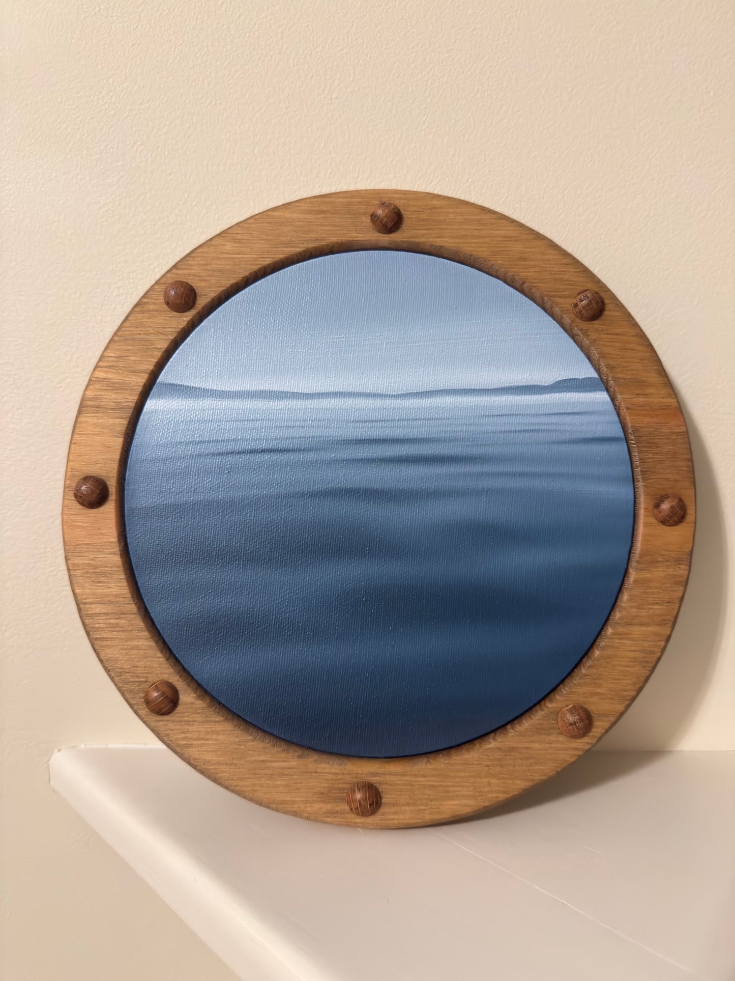 dark blue porthole painting