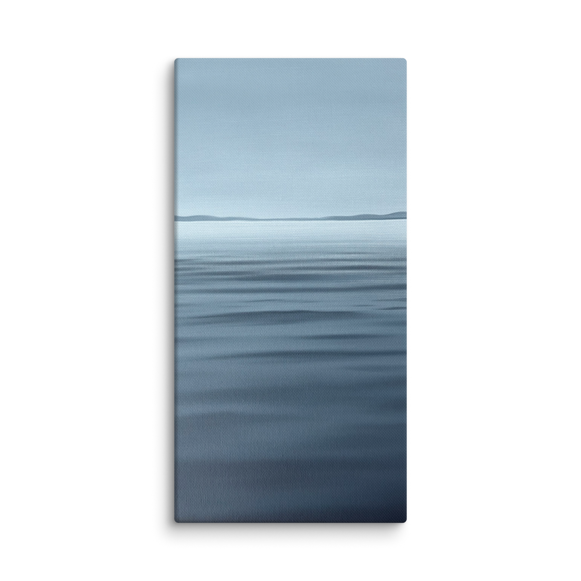 A vertical canvas wall art print depicting a calm blue ocean with a distant horizon under a pale sky, shown against a plain white background.