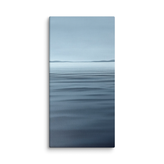A vertical canvas wall art print depicting a calm blue ocean with a distant horizon under a pale sky, shown against a plain white background.